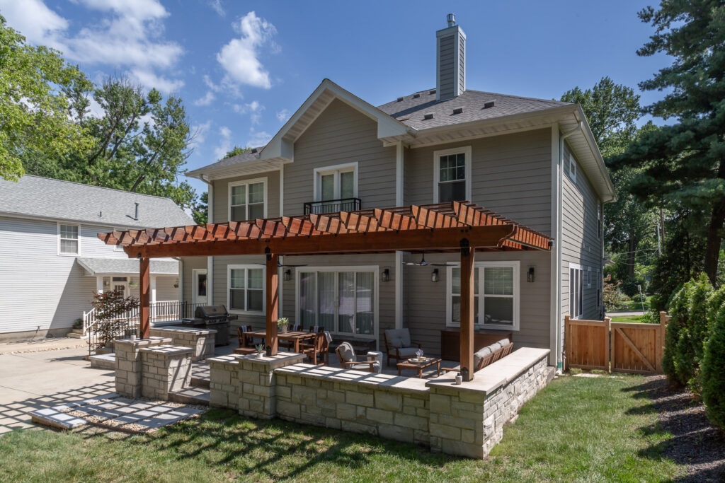 Wide shot - Exterior of home with Pergola and patio built by Rosette Forever Homes