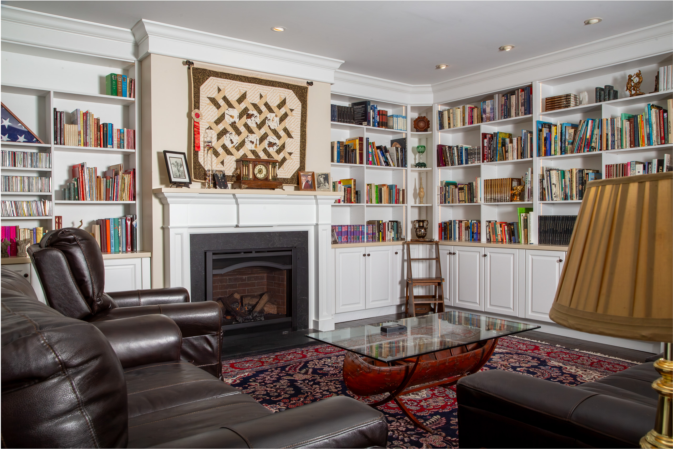 Wide shot of the Library with massive built in bookshelves.